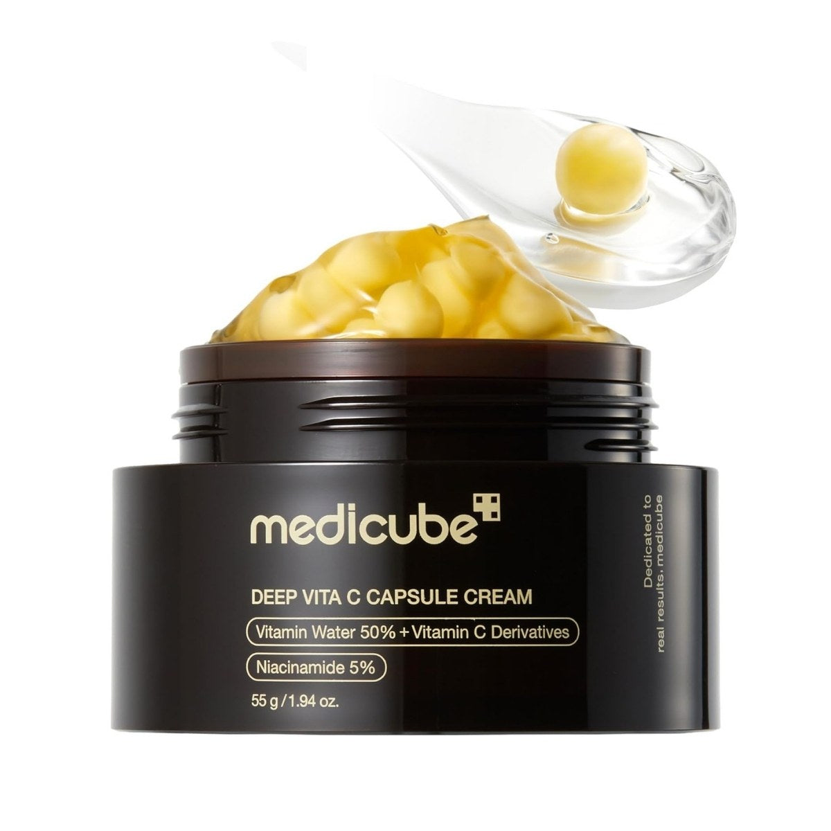 Medicube Deep Vita C Capsule Cream. Envase de la crema facial iluminadora con vitamina C, toma frontal.
